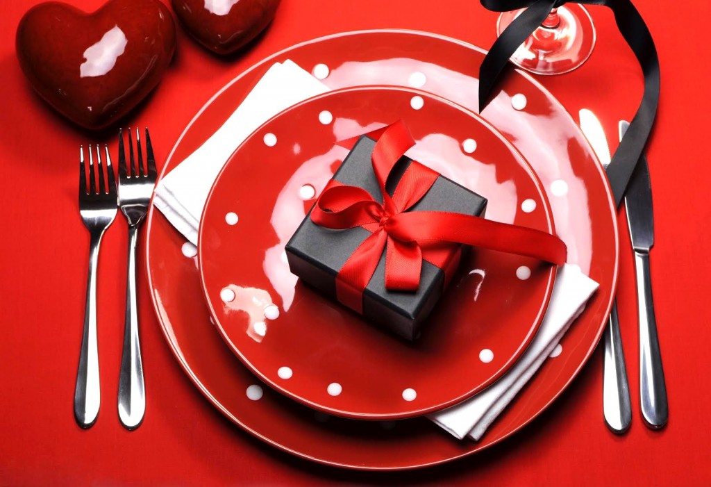 Modern red Valentine romantic table setting with polka dot plate